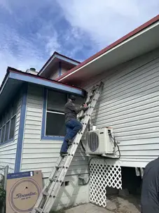 man climbing up ladder