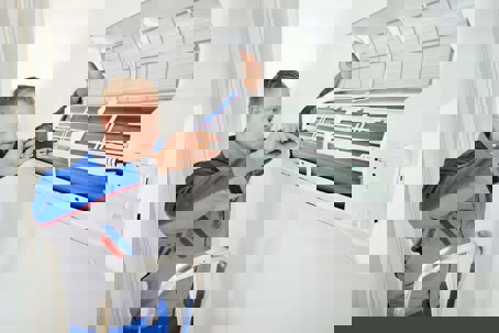 technician fixing mini-split system